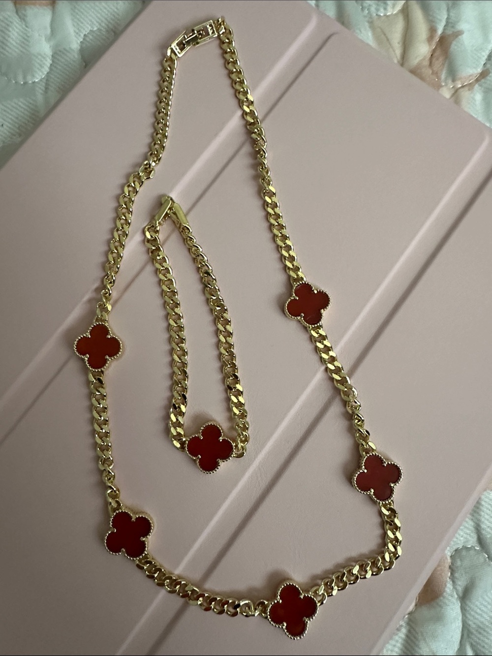 Elegant Gold and Red Clover Necklace and Bracelet Set